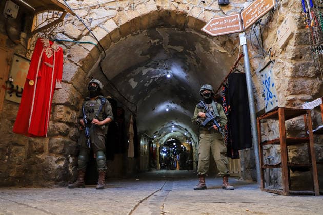 Israeli settlers under army protection raid Old City of Hebron in West Bank HEBRON, WEST BANK, PALESTINE - JULY 11: Israeli forces block entry and exit points with iron barricades to restrict the movement of Palestinians as Israeli settlers, escorted by Israeli forces, raid the Old City area of Hebron in the southern West Bank, Palestine on July 11, 2026. Amer Shallodi Anadolu Hebron West Bank. Editorial use only. Please get in touch for any other usage.  Copyright: x2026xAnadoluxAmerxShallodix