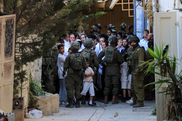 Israeli settlers under army protection raid Old City of Hebron in West Bank HEBRON, WEST BANK, PALESTINE - JULY 11: Israeli forces block entry and exit points with iron barricades to restrict the movement of Palestinians as Israeli settlers, escorted by Israeli forces, raid the Old City area of Hebron in the southern West Bank, Palestine on July 11, 2026. Amer Shallodi Anadolu Hebron West Bank. Editorial use only. Please get in touch for any other usage.  Copyright: x2026xAnadoluxAmerxShallodix