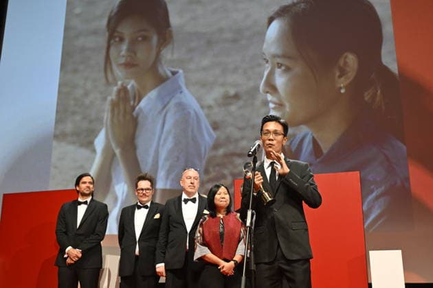 ***CAPTION CORRECTION*** The final day of the 60th Karlovy Vary International Film Festival, on July 11, 2026. The Crystal Globe was awarded to the co-production with the participation of the Czech Republic, Fruit Gathering, directed by Burmese director Aung Phyoe (front). (CTKxPhoto KaterinaxSulova) CTKPhotoP2026071104703  CTKPhotoP2026071104703
