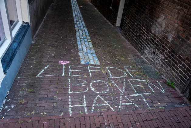 July 11, 2026, Schiedam, South Holland, Netherlands: 11 July 2026. Pro-asylum seeker demonstrators have written Love Above Hate (translated from Dutch) along the route being marched by anti-asylum seeker demonstrators. In Schiedam, the Netherlands, a pro-asylum seeker demonstration promoted by Extinction Rebellion countered a demonstration called the Vrouwenmars tegen het AZC (Women s March Against the AZC) promoted by anti-asylum seeker centre groups. Both events took place in the center of Schiedam. Schiedam Netherlands - ZUMAp202 20260711_zip_p202_005 Copyright: xJamesxPetermeierx