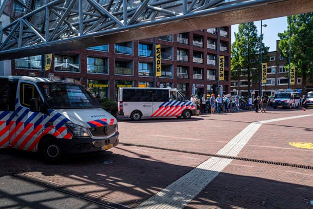 July 11, 2026, Schiedam, South Holland, Netherlands: 11 July 2026. Dutch police gathered around a group of pro-asylum seeker activists at Schiedam Centrum train station. In Schiedam, the Netherlands, a pro-asylum seeker demonstration promoted by Extinction Rebellion countered a demonstration called the Vrouwenmars tegen het AZC (Women s March Against the AZC) promoted by anti-asylum seeker centre groups. Both events took place in the center of Schiedam. Schiedam Netherlands - ZUMAp202 20260711_zip_p202_010 Copyright: xJamesxPetermeierx