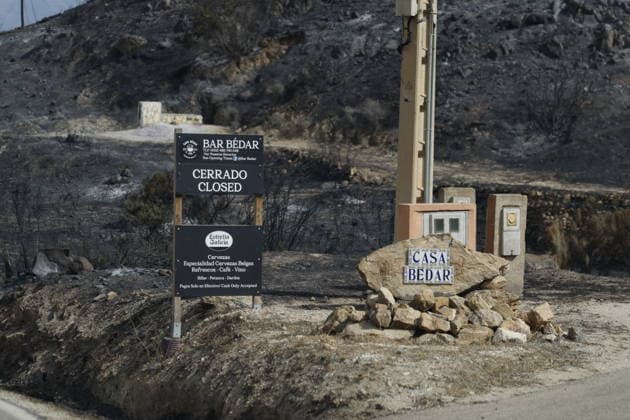 Deadly wildfire scorches Almeria province in Spain LOS GALLARDOS, SPAIN - JULY 11: Emergency operations continue near Bedar as security forces restrict access to the wildfire-affected area and direct local residents away from danger in Almeria province, Spain, on July 11, 2026. Firefighters, supported by helicopters and other emergency teams, carry out containment, surveillance and recovery operations across the burned landscape, while roads leading toward the fire zone remain under security control. Improved weather conditions helped crews gain the upper hand over the blaze and intensify efforts to prevent it from spreading further. The wildfire killed at least 12 people and burned about 6,600 hectares of forest, farmland and surrounding r  Copyright: x2026xAnadoluxPabloxMiranzox