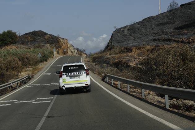 Deadly wildfire scorches Almeria province in Spain LOS GALLARDOS, SPAIN - JULY 11: Emergency operations continue near Bedar as security forces restrict access to the wildfire-affected area and direct local residents away from danger in Almeria province, Spain, on July 11, 2026. Firefighters, supported by helicopters and other emergency teams, carry out containment, surveillance and recovery operations across the burned landscape, while roads leading toward the fire zone remain under security control. Improved weather conditions helped crews gain the upper hand over the blaze and intensify efforts to prevent it from spreading further. The wildfire killed at least 12 people and burned about 6,600 hectares of forest, farmland and surrounding r  Copyright: x2026xAnadoluxPabloxMiranzox