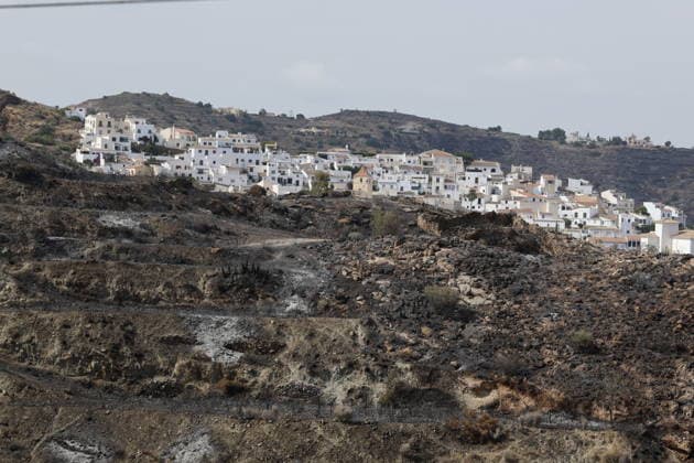 Deadly wildfire scorches Almeria province in Spain LOS GALLARDOS, SPAIN - JULY 11: Emergency operations continue near Bedar as security forces restrict access to the wildfire-affected area and direct local residents away from danger in Almeria province, Spain, on July 11, 2026. Firefighters, supported by helicopters and other emergency teams, carry out containment, surveillance and recovery operations across the burned landscape, while roads leading toward the fire zone remain under security control. Improved weather conditions helped crews gain the upper hand over the blaze and intensify efforts to prevent it from spreading further. The wildfire killed at least 12 people and burned about 6,600 hectares of forest, farmland and surrounding r  Copyright: x2026xAnadoluxPabloxMiranzox