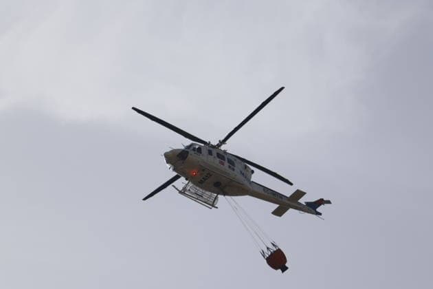 Deadly wildfire scorches Almeria province in Spain LOS GALLARDOS, SPAIN - JULY 11: Emergency operations continue near Bedar as security forces restrict access to the wildfire-affected area and direct local residents away from danger in Almeria province, Spain, on July 11, 2026. Firefighters, supported by helicopters and other emergency teams, carry out containment, surveillance and recovery operations across the burned landscape, while roads leading toward the fire zone remain under security control. Improved weather conditions helped crews gain the upper hand over the blaze and intensify efforts to prevent it from spreading further. The wildfire killed at least 12 people and burned about 6,600 hectares of forest, farmland and surrounding r  Copyright: x2026xAnadoluxPabloxMiranzox
