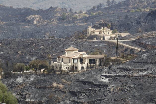Deadly wildfire scorches Almeria province in Spain LOS GALLARDOS, SPAIN - JULY 11: Emergency operations continue near Bedar as security forces restrict access to the wildfire-affected area and direct local residents away from danger in Almeria province, Spain, on July 11, 2026. Firefighters, supported by helicopters and other emergency teams, carry out containment, surveillance and recovery operations across the burned landscape, while roads leading toward the fire zone remain under security control. Improved weather conditions helped crews gain the upper hand over the blaze and intensify efforts to prevent it from spreading further. The wildfire killed at least 12 people and burned about 6,600 hectares of forest, farmland and surrounding r  Copyright: x2026xAnadoluxPabloxMiranzox