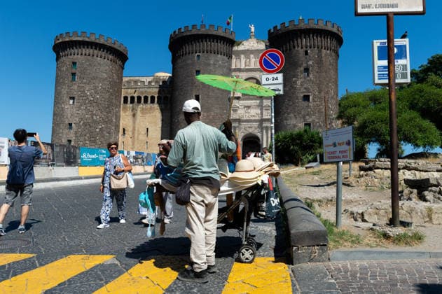 African heatwave in Naples NAPLES, ITALY - JULY 11: A vendor of umbrellas and hats is seen during the African heatwave in Naples on July 11, 2026. A new and more intense heatwave is sweeping across Italy and Western Europe, with temperatures peaking at 38-41 degrees celsius in southern Italy. Eliano Imperato Anadolu Naples Italy. Editorial use only. Please get in touch for any other usage.  Copyright: x2026xAnadoluxElianoxImperatox