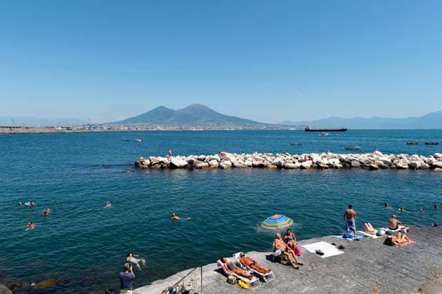 African heatwave in Naples NAPLES, ITALY - JULY 11: People sunbath and swim during the African heatwave in Naples on July 11, 2026. A new and more intense heatwave is sweeping across Italy and Western Europe, with temperatures peaking at 38-41 degrees celsius in southern Italy. Eliano Imperato Anadolu Naples Italy. Editorial use only. Please get in touch for any other usage.  Copyright: x2026xAnadoluxElianoxImperatox