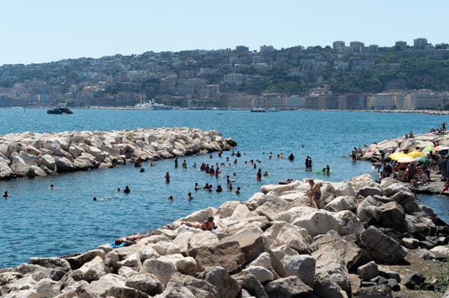 African heatwave in Naples NAPLES, ITALY - JULY 11: People sunbath and swim during the African heatwave in Naples on July 11, 2026. A new and more intense heatwave is sweeping across Italy and Western Europe, with temperatures peaking at 38-41 degrees celsius in southern Italy. Eliano Imperato Anadolu Naples Italy. Editorial use only. Please get in touch for any other usage.  Copyright: x2026xAnadoluxElianoxImperatox