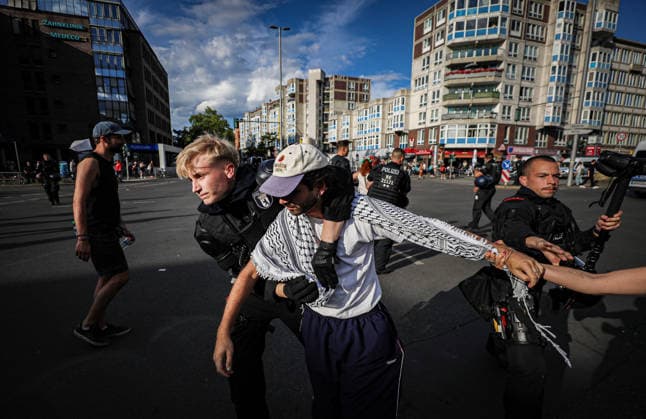 July 11, 2026, Berlin, Berlin, Germany: Berlin police detain several demonstrators during an anti-war protest against Rheinmetall and the German arms industry in Berlin, Germany, on July 11, 2026. Officers moved in to arrest multiple protesters after the demonstration, with several participants being physically restrained during the police operation. Berlin Germany - ZUMAa268 20260711_zip_a268_032 Copyright: xAbdelrahmanxAlkahloutx