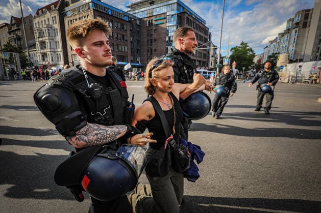 July 11, 2026, Berlin, Berlin, Germany: Berlin police detain several demonstrators during an anti-war protest against Rheinmetall and the German arms industry in Berlin, Germany, on July 11, 2026. Officers moved in to arrest multiple protesters after the demonstration, with several participants being physically restrained during the police operation. Berlin Germany - ZUMAa268 20260711_zip_a268_033 Copyright: xAbdelrahmanxAlkahloutx
