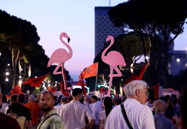 July 11, 2026, Tirane, Albania, ALB: Protesters hold signs and Albanian national flags as they take part in a demonstration in front of the PM office in Tirana on July 11, 2026, opposing the construction of a luxury resort in a protected natural area near the city of Vlore. Several thousand citizens demonstrated in Tirana for the 42nd consecutive night to demand transparency on a luxury tourism complex project in the protected area of Narta Lagoon in the city of Vlore linked to US President Donald Trump s son-in-law, Jared Kushner, and his wife, Ivanka Trump. The project was planned for two areas along the Adriatic coast: the protected delta area of Vjosa-Narta and the nearby uninhabited island of Sazan. Tirane ALB  - ZUMAs337 20260711_znp_s337_014 Copyright: xGentxShkullakux