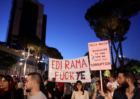 July 11, 2026, Tirane, Albania, ALB: Protesters hold signs and Albanian national flags as they take part in a demonstration in front of the PM office in Tirana on July 11, 2026, opposing the construction of a luxury resort in a protected natural area near the city of Vlore. Several thousand citizens demonstrated in Tirana for the 42nd consecutive night to demand transparency on a luxury tourism complex project in the protected area of Narta Lagoon in the city of Vlore linked to US President Donald Trump s son-in-law, Jared Kushner, and his wife, Ivanka Trump. The project was planned for two areas along the Adriatic coast: the protected delta area of Vjosa-Narta and the nearby uninhabited island of Sazan. Tirane ALB  - ZUMAs337 20260711_znp_s337_020 Copyright: xGentxShkullakux