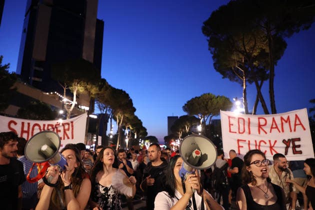 July 11, 2026, Tirane, Albania, ALB: Protesters hold signs and Albanian national flags as they take part in a demonstration in front of the PM office in Tirana on July 11, 2026, opposing the construction of a luxury resort in a protected natural area near the city of Vlore. Several thousand citizens demonstrated in Tirana for the 42nd consecutive night to demand transparency on a luxury tourism complex project in the protected area of Narta Lagoon in the city of Vlore linked to US President Donald Trump s son-in-law, Jared Kushner, and his wife, Ivanka Trump. The project was planned for two areas along the Adriatic coast: the protected delta area of Vjosa-Narta and the nearby uninhabited island of Sazan. Tirane ALB  - ZUMAs337 20260711_znp_s337_022 Copyright: xGentxShkullakux