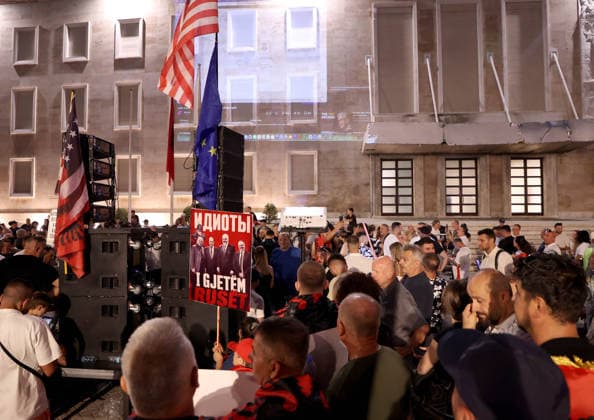 July 11, 2026, Tirane, Albania, ALB: Protesters hold signs and Albanian national flags as they take part in a demonstration in front of the PM office in Tirana on July 11, 2026, opposing the construction of a luxury resort in a protected natural area near the city of Vlore. Several thousand citizens demonstrated in Tirana for the 42nd consecutive night to demand transparency on a luxury tourism complex project in the protected area of Narta Lagoon in the city of Vlore linked to US President Donald Trump s son-in-law, Jared Kushner, and his wife, Ivanka Trump. The project was planned for two areas along the Adriatic coast: the protected delta area of Vjosa-Narta and the nearby uninhabited island of Sazan. Tirane ALB  - ZUMAs337 20260711_znp_s337_028 Copyright: xGentxShkullakux