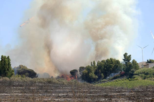 Wildfires continue on the Italian island of Sicily PALERMO, ITALY - JULY 11: Smoke rises after a wildfire that breaks out in a maquis-shrubland area near the Partinico municipality of Palermo in Sicily, Italy on July 11, 2026. Firefighting teams intervened with ground crews, water-discharging aircraft, and helicopters to bring the blaze under control Alberto Lo Bianco Anadolu Sicily Italy. Editorial use only. Please get in touch for any other usage.  Copyright: x2026xAnadoluxAlbertoxLoxBiancox