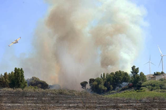 Wildfires continue on the Italian island of Sicily PALERMO, ITALY - JULY 11: Smoke rises after a wildfire that breaks out in a maquis-shrubland area near the Partinico municipality of Palermo in Sicily, Italy on July 11, 2026. Firefighting teams intervened with ground crews, water-discharging aircraft, and helicopters to bring the blaze under control Alberto Lo Bianco Anadolu Sicily Italy. Editorial use only. Please get in touch for any other usage.  Copyright: x2026xAnadoluxAlbertoxLoxBiancox