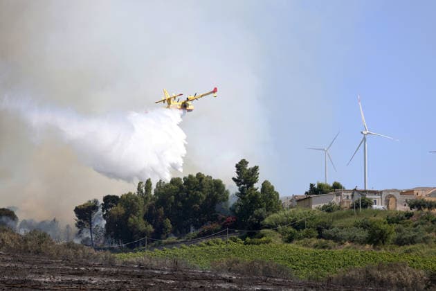 Wildfires continue on the Italian island of Sicily PALERMO, ITALY - JULY 11: Smoke rises after a wildfire that breaks out in a maquis-shrubland area near the Partinico municipality of Palermo in Sicily, Italy on July 11, 2026. Firefighting teams intervened with ground crews, water-discharging aircraft, and helicopters to bring the blaze under control Alberto Lo Bianco Anadolu Sicily Italy. Editorial use only. Please get in touch for any other usage.  Copyright: x2026xAnadoluxAlbertoxLoxBiancox