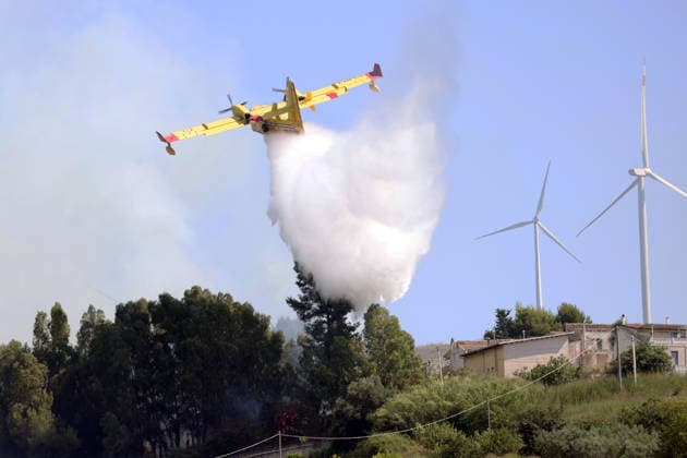 Wildfires continue on the Italian island of Sicily PALERMO, ITALY - JULY 11: Italian firefighters battle a wildfire that broke out in a maquis-shrubland area near the Partinico municipality of Palermo in Sicily, Italy on July 11, 2026. Firefighting teams intervened with ground crews, water-discharging aircraft, and helicopters to bring the blaze under control. Alberto Lo Bianco Anadolu Sicily Italy. Editorial use only. Please get in touch for any other usage.  Copyright: x2026xAnadoluxAlbertoxLoxBiancox