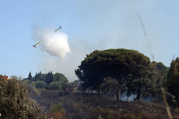 Wildfires continue on the Italian island of Sicily PALERMO, ITALY - JULY 11: Italian firefighters battle a wildfire that broke out in a maquis-shrubland area near the Partinico municipality of Palermo in Sicily, Italy on July 11, 2026. Firefighting teams intervened with ground crews, water-discharging aircraft, and helicopters to bring the blaze under control. Alberto Lo Bianco Anadolu Sicily Italy. Editorial use only. Please get in touch for any other usage.  Copyright: x2026xAnadoluxAlbertoxLoxBiancox