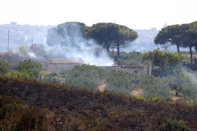 Wildfires continue on the Italian island of Sicily PALERMO, ITALY - JULY 11: Italian firefighters battle a wildfire that broke out in a maquis-shrubland area near the Partinico municipality of Palermo in Sicily, Italy on July 11, 2026. Firefighting teams intervened with ground crews, water-discharging aircraft, and helicopters to bring the blaze under control. Alberto Lo Bianco Anadolu Palermo Italy. Editorial use only. Please get in touch for any other usage.  Copyright: x2026xAnadoluxAlbertoxLoxBiancox