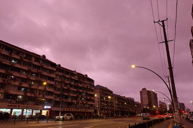 SHANGHAI, CHINA - JULY 11: The sky presents a rare dark red hue on July 11, 2026 in Shanghai, China. Typhoon Bavi, the ninth typhoon of the year, is expected to make landfall along the coast between Wenling and Rui an in east China s Zhejiang Province from the night of July 11 to early morning of July 12, according to the National Meteorological Center.  Copyright: xVCGx 111653702542