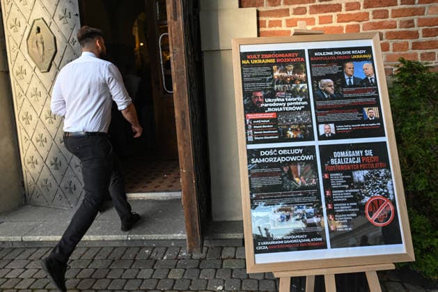 Poland Commemorates 83rd Anniversary Of Volhynia Genocide RZESZOW, POLAND - JULY 11: A man walks past a large informational display board set up outside a church entrance during a solemn commemoration on July 11, 2026, in Rzeszow, Poland. The informational board addresses historical and actual political aspects surrounding the Volhynia massacres, marking the 83rd anniversary of Bloody Sunday to honor over 100,000 Polish civilians tortured and murdered by the Ukrainian Insurgent Army (UPA) and the Organization of Ukrainian Nationalists (OUN-B) across Volhynia and Eastern Galicia between 1943 and 1947. Rzeszow Poland  Copyright: xArturxWidakx originalFilename: widak-polandma260711_np1nP.jpg