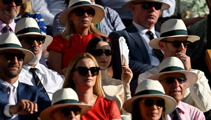 (260712) -- LONDON, July 12, 2026 -- Actress Lily Collins (C) watches the women s singles final between Linda Noskova and Karolina Muchova of the Czech Republic at the Wimbledon Tennis Championships in London, Britain, on July 11, 2026. ) (SP)BRITAIN-LONDON-TENNIS-WIMBLEDON-WOMEN S SINGLES LixYing 