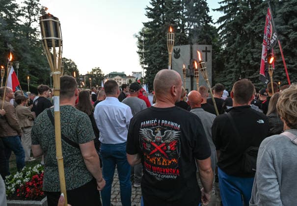 Poland Commemorates 83rd Anniversary Of Volhynia Genocide RZESZOW, POLAND - JULY 11: Participants carrying torches gather outside the Home Army (AK) Monument during the final part of a solemn commemoration on July 11, 2026, in Rzeszow, Poland. One participant wears a T-shirt featuring a Polish eagle emblem alongside the text Memory and Truth. Volhynia Massacre. We Remember the Victims 1943. The march, organized by nationalist groups including Oboz Narodowo-Radykalny (ONR), marks the 83rd anniversary of Bloody Sunday to honor over 100,000 Polish civilians tortured and murdered by the Ukrainian Insurgent Army (UPA) and the Organization of Ukrainian Nationalists (OUN-B) across Volhynia and Eastern Galicia between 1943 and 1947. Rzeszow  Copyright: xArturxWidakx originalFilename: widak-polandma260711_npVgX.jpg