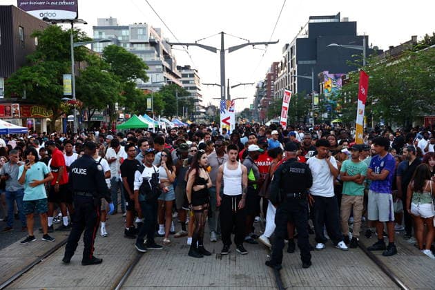 July 11, 2026, Toronto, On, Canada: Toronto Police hold back crowds as they respond to an active shooter at the Salsa on St. Clair event in Toronto, on Saturday, July 11, 2026. Toronto Canada  - ZUMAc35_ 20260711_zaf_c35_016 Copyright: xKeitoxNewmanx