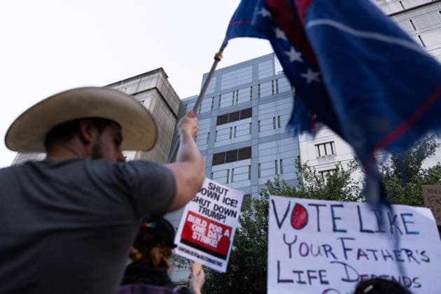 July 11, 2026, Houston, Texas, USA: A protester waves a flag in front of the Federal Detention Center in Downtown Houston to protest against U.S. Immigration and Customs Enforcement (ICE) after Lorenzo Salgado Araujo was fatally shot by an ICE agent during an attempted immigration enforcement operation, an incident that has prompted calls from community leaders and elected officials for an independent investigation, Saturday, July 11, in Houston, Texas. Houston USA  - ZUMAg287 20260711_zsp_g287_012 Copyright: xMatthewxGuzmanx