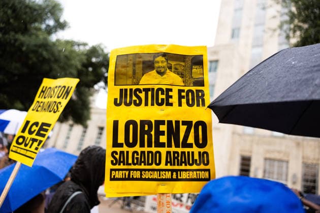 July 11, 2026, Houston, Texas, USA: A protester holds a sign at Houston City Hall to protest against U.S. Immigration and Customs Enforcement (ICE) after Lorenzo Salgado Araujo was fatally shot by an ICE agent during an attempted immigration enforcement operation, an incident that has prompted calls from community leaders and elected officials for an independent investigation, Saturday, July 11, in Houston, Texas. Houston USA  - ZUMAg287 20260711_zsp_g287_019 Copyright: xMatthewxGuzmanx