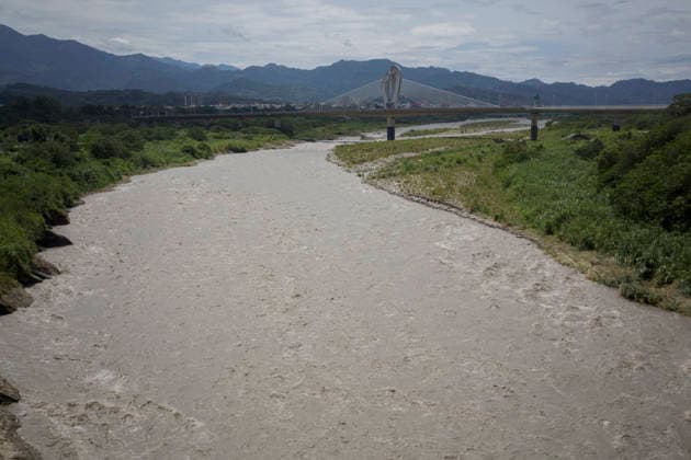July 12, 2026, Taichung, Taiwan: The Dajia River flows rapidly in Taichung, Taiwan. The Central Weather Administration (CWA) lifted its land and sea warnings for Typhoon Bavi on Sunday morning as the storm weakened and moved away from Taiwan, after bringing heavy rain and strong winds to parts of the country. Taichung Taiwan  - ZUMAc217 20260712_zip_c217_004 Copyright: xAndrexM.xChangx