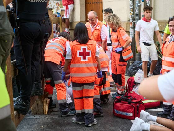 Sixth bull run of the 2026 San Fermín Festival, featuring bulls from the La Palmosilla ranch; Red Cross volunteers treat an injured person from the sixth bull run of the 2026 San Fermín Festival, on July 12, 2026, in Pamplona, Navarre, Spain. This year, bulls from the La Palmosilla ranch are the stars of the sixth running of the San Fermín Festival in Spain.  Copyright: xEduardoxSanzx 7660337