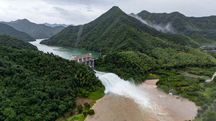 JINHUA, CHINA - JULY 12: In an aerial view, sluice gates of Andi Reservoir open to release flood water on July 12, 2026 in Jinhua, Zhejiang Province of China. Affected by Typhoon Bavi, Andi Reservoir in Jinhua recorded a water level of 125.71 meters on July 12, close to its flood threshold.  Copyright: xVCGx 111653805744