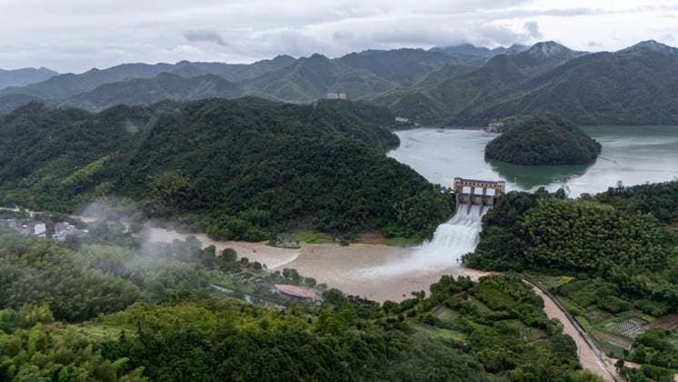 JINHUA, CHINA - JULY 12: In an aerial view, sluice gates of Andi Reservoir open to release flood water on July 12, 2026 in Jinhua, Zhejiang Province of China. Affected by Typhoon Bavi, Andi Reservoir in Jinhua recorded a water level of 125.71 meters on July 12, close to its flood threshold.  Copyright: xVCGx 111653805746