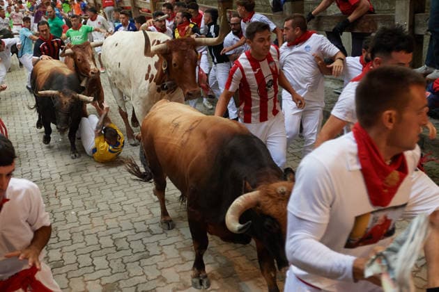 Sixth Running of the Bulls San Fermín 2026 in Pamplona - 12 Jul 2026 A bull runner is dragged by the herd of bulls in the sixth running of the bulls during the celebration of the San Fermín 2026 festivities. Pamplona Spain Copyright: xElsaxAxBravox xSOPAxImagesx Sixth Running of the Bulls San Fermin 2026_EAB_8309 (3)