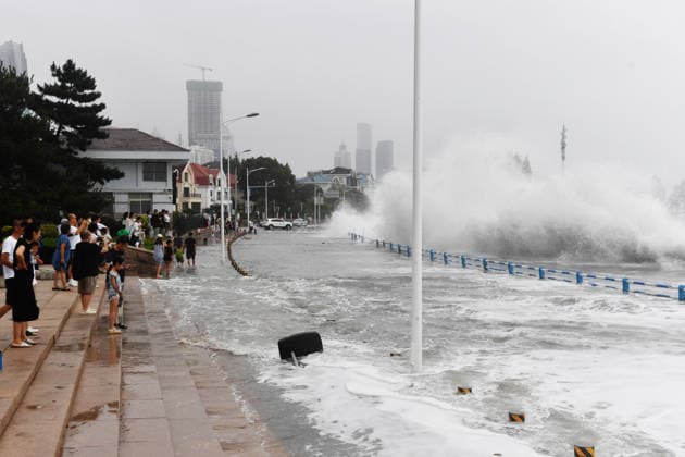 Tourist captures the waves stirred up by Typhoon Bavi on the coast of Aomen Road in Shinan District, Qingdao City, Shandong Province, China on July 12, 2026. Qingdao Shandong China  Copyright: xCFOTOx i1783876254787