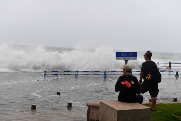 Tourist captures the waves stirred up by Typhoon Bavi on the coast of Aomen Road in Shinan District, Qingdao City, Shandong Province, China on July 12, 2026. Qingdao Shandong China  Copyright: xCFOTOx i1783876255387