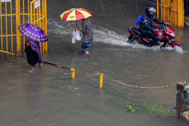 Monsoon downpour made travel slow and dangerous in Dhaka - 12 Jul 2026 People struggle to walk through a waterlogged street following heavy rains causing much suffering for pedestrians and commuters. Monsoon downpour made travel slow and dangerous. Dhaka Bangladesh Copyright: xSazzadxHossainx xSOPAxImagesx Photo_Sazzad Hossain_Monsoon rain (13)