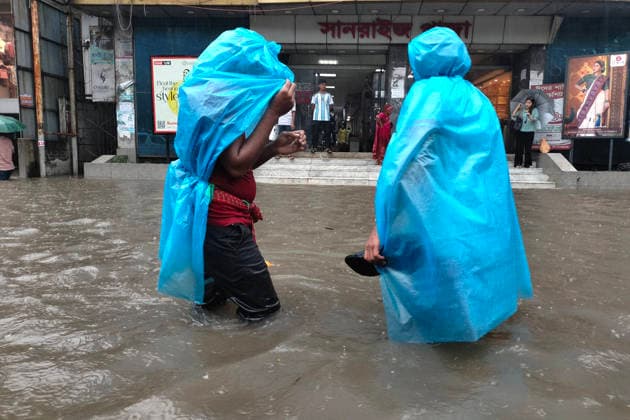 July 12, 2026, Dhaka, Dhaka, Bangladesh: DHAKA, Bangladesh, July 12, 2026 Ã¢â‚¬ Overnight heavy rainfall triggered widespread waterlogging across Dhaka on Sunday, disrupting daily life and causing severe hardship for residents...Several low-lying areas of the capital were submerged under knee- to waist-deep water, forcing commuters, schoolchildren, office workers and daily wage earners to wade through flooded streets. In several neighborhoods, mothers were seen carrying their children, while parents guided students by hand through waterlogged roads...The persistent rainfall caused severe traffic congestion on major roads across the capital, leaving many commuters stranded for hours and delaying travel. According to local residents, inade  - ZUMAk185 20260712_zip_k185_003 Copyright: xRubelxKarmakerx