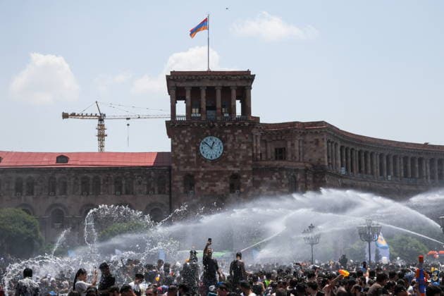 ARMENIA, YEREVAN - JULY 12, 2026: Tank trucks pour water over citizens in Republic Square during the traditional feast of Vardavar celebrated by the Armenian Apostolic Church to mark the Transfiguration of Christ Yerevan Armenia  - ZUMAt113 20260712_zaa_t113_131 Copyright: xAlexanderxPatrinx