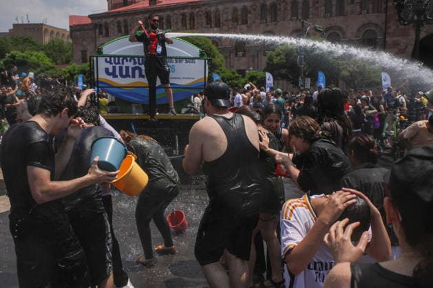 ARMENIA, YEREVAN - JULY 12, 2026: A tank truck pours water over citizens in Republic Square during the traditional feast of Vardavar celebrated by the Armenian Apostolic Church to mark the Transfiguration of Christ Yerevan Armenia  - ZUMAt113 20260712_zaa_t113_136 Copyright: xAlexanderxPatrinx