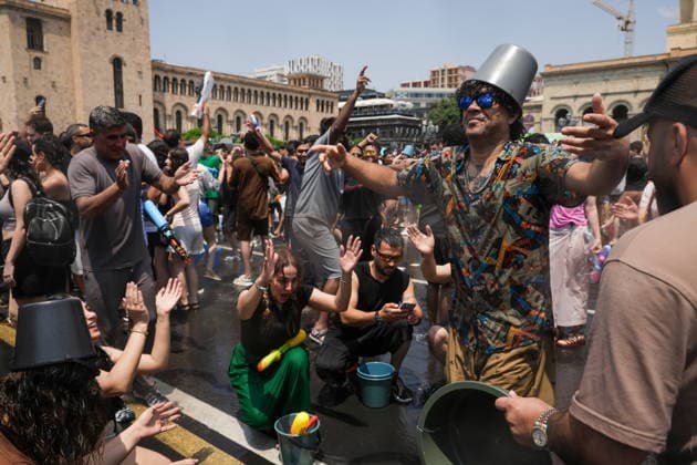 ARMENIA, YEREVAN - JULY 12, 2026: Citizens enjoy dousing each other in Republic Square during the traditional feast of Vardavar celebrated by the Armenian Apostolic Church to mark the Transfiguration of Christ Yerevan Armenia  - ZUMAt113 20260712_zaa_t113_138 Copyright: xAlexanderxPatrinx