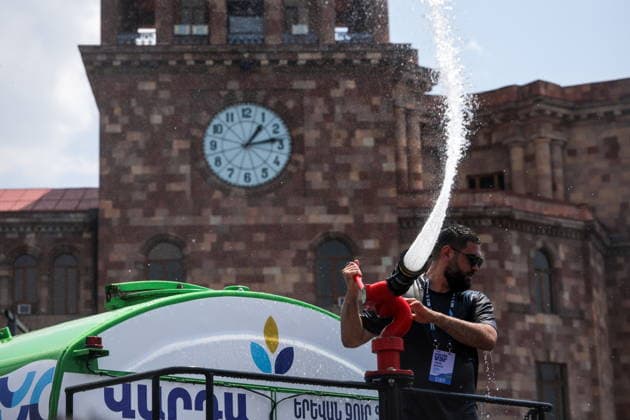 ARMENIA, YEREVAN - JULY 12, 2026: A man pours water from a tank truck in Republic Square during the traditional feast of Vardavar celebrated by the Armenian Apostolic Church to mark the Transfiguration of Christ Yerevan Armenia  - ZUMAt113 20260712_zaa_t113_139 Copyright: xAlexanderxPatrinx