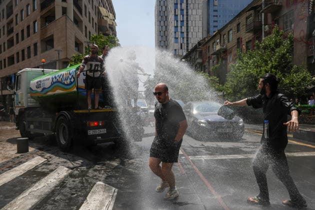 ARMENIA, YEREVAN - JULY 12, 2026: A tank truck pours water over citizens during the traditional feast of Vardavar celebrated by the Armenian Apostolic Church to mark the Transfiguration of Christ Yerevan Armenia  - ZUMAt113 20260712_zaa_t113_143 Copyright: xAlexanderxPatrinx