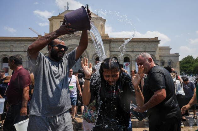 ARMENIA, YEREVAN - JULY 12, 2026: Citizens enjoy dousing each other in Republic Square during the traditional feast of Vardavar celebrated by the Armenian Apostolic Church to mark the Transfiguration of Christ Yerevan Armenia  - ZUMAt113 20260712_zaa_t113_158 Copyright: xAlexanderxPatrinx