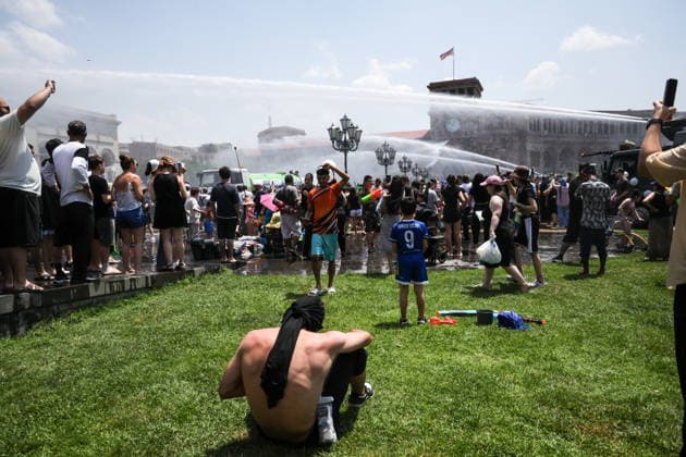 ARMENIA, YEREVAN - JULY 12, 2026: Tank trucks pour water over citizens in Republic Square during the traditional feast of Vardavar celebrated by the Armenian Apostolic Church to mark the Transfiguration of Christ Yerevan Armenia  - ZUMAt113 20260712_zaa_t113_174 Copyright: xAlexanderxPatrinx