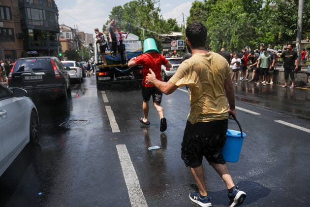 ARMENIA, YEREVAN - JULY 12, 2026: A tank truck sprays water over citizens during the traditional feast of Vardavar celebrated by the Armenian Apostolic Church to mark the Transfiguration of Christ Yerevan Armenia  - ZUMAt113 20260712_zaa_t113_181 Copyright: xAlexanderxPatrinx