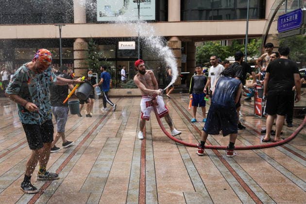 ARMENIA, YEREVAN - JULY 12, 2026: Citizens enjoy getting doused with a hose during the traditional feast of Vardavar celebrated by the Armenian Apostolic Church to mark the Transfiguration of Christ Yerevan Armenia  - ZUMAt113 20260712_zaa_t113_188 Copyright: xAlexanderxPatrinx